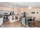 Open-concept kitchen with eat-in breakfast bar and adjacent dining space creates a cozy atmosphere at 1744 E Fremont Rd, Phoenix, AZ 85042