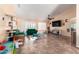 Bright living room with neutral walls, ceiling fan, and large windows offers comfortable seating at 1744 E Fremont Rd, Phoenix, AZ 85042