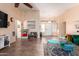 Spacious living room features tile flooring and ample natural light from the front door windows at 1744 E Fremont Rd, Phoenix, AZ 85042