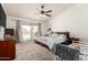 Primary bedroom with sliding glass door leading to the pool area provides an inviting retreat at 1744 E Fremont Rd, Phoenix, AZ 85042