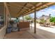 Covered patio area with bar and multiple seating areas at 1744 E Fremont Rd, Phoenix, AZ 85042