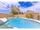 Inviting pool with clear blue water, perfect for relaxation, surrounded by trees at 1744 E Fremont Rd, Phoenix, AZ 85042