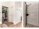 Walk in shower with gray accents and decorative tile and stone flooring at 1744 E Fremont Rd, Phoenix, AZ 85042