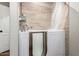 Accessible bathroom featuring a walk-in tub with shower, safety features, and modern tile surround at 18650 N 91St Ave # 3301, Peoria, AZ 85382