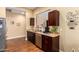 Efficient kitchen space with stainless steel appliances, granite countertops and dark cabinetry that combines style and functionality at 18650 N 91St Ave # 3301, Peoria, AZ 85382
