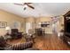 Inviting living room featuring cozy seating, laminate flooring, and natural light at 18650 N 91St Ave # 3301, Peoria, AZ 85382