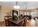 Inviting living room with a fireplace, comfortable seating, and an open layout that extends to the dining area at 18650 N 91St Ave # 3301, Peoria, AZ 85382