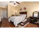 Comfortable main bedroom featuring a plush bed, warm lighting, and a cozy chair for relaxing at 18650 N 91St Ave # 3301, Peoria, AZ 85382