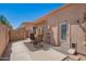 Enclosed patio featuring stucco walls, retractable awning, and comfortable seating, providing privacy and shade at 18650 N 91St Ave # 3301, Peoria, AZ 85382
