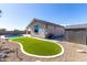 Spacious backyard with artificial turf, a shed and a sparkling pool, perfect for relaxation and entertainment at 18675 W Foothill Dr, Surprise, AZ 85387