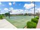 Full community basketball court with well-maintained surface and equipment, surrounded by green spaces at 18675 W Foothill Dr, Surprise, AZ 85387