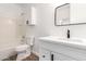 Bright bathroom featuring a shower-tub combination, modern vanity, and sleek black hardware at 18675 W Foothill Dr, Surprise, AZ 85387