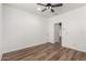 Bedroom with hard wood floor and a ceiling fan at 18675 W Foothill Dr, Surprise, AZ 85387
