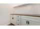 Walk-in closet featuring custom shelving and ample storage space at 18675 W Foothill Dr, Surprise, AZ 85387