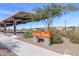 Copper Park sign with covered parking in a well-maintained community at 18675 W Foothill Dr, Surprise, AZ 85387