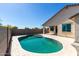 Refreshing pool with a tiled patio, perfect for outdoor relaxation at 18675 W Foothill Dr, Surprise, AZ 85387
