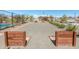 Shuffleboard court with benches and gravel, perfect for outdoor fun at 18675 W Foothill Dr, Surprise, AZ 85387
