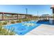 Community splash pad with a sun design, offering refreshing water play for residents at 18675 W Foothill Dr, Surprise, AZ 85387