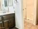 Well-lit bathroom with a clean, bright shower, functional vanity and a large mirror at 1927 E Hampton Ave # 260, Mesa, AZ 85204