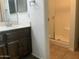 Bathroom featuring a vanity with dark wood cabinets and a walk-in shower at 1927 E Hampton Ave # 260, Mesa, AZ 85204