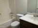 Bathroom featuring a vanity with dark wood cabinets, a toilet, and a tub/shower combo at 1927 E Hampton Ave # 260, Mesa, AZ 85204