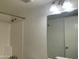 Bright bathroom featuring a shower and vanity with modern lighting fixtures at 1927 E Hampton Ave # 260, Mesa, AZ 85204