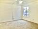 A serene bedroom is filled with natural light, complete with a ceiling fan for added comfort at 1927 E Hampton Ave # 260, Mesa, AZ 85204