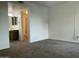 Carpeted bedroom offering a view of the attached bathroom at 1927 E Hampton Ave # 260, Mesa, AZ 85204