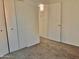Bedroom features neutral walls and carpet with closet and interior access at 1927 E Hampton Ave # 260, Mesa, AZ 85204