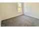 Cozy bedroom features neutral walls, carpet and a window offering natural light at 1927 E Hampton Ave # 260, Mesa, AZ 85204
