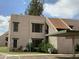 Charming two-story condo with well-maintained landscaping, reserved parking, and inviting curb appeal at 1927 E Hampton Ave # 260, Mesa, AZ 85204