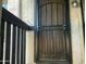Exterior shot of front door with modern iron security features, and address at 1927 E Hampton Ave # 260, Mesa, AZ 85204