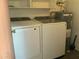 Convenient laundry area featuring washer, dryer, and water heater at 1927 E Hampton Ave # 260, Mesa, AZ 85204
