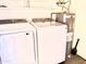 Convenient laundry area with modern appliances and hot water tank at 1927 E Hampton Ave # 260, Mesa, AZ 85204