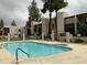 Community pool area surrounded by well-maintained condo buildings at 1927 E Hampton Ave # 260, Mesa, AZ 85204