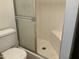 Bathroom shower with glass doors and a built-in seat at 1927 E Hampton Ave # 260, Mesa, AZ 85204