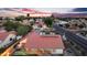 An aerial view of the home and neighborhood at sunset showcases the solar panels at 1940 E Citation Ln, Tempe, AZ 85284