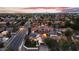 Wide aerial view reveals a charming home with solar panels, nestled in a picturesque neighborhood at dusk at 1940 E Citation Ln, Tempe, AZ 85284