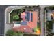 Aerial view of a red tiled roof home with solar panels, landscaping, and a private backyard pool oasis at 1940 E Citation Ln, Tempe, AZ 85284