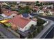 Stunning aerial view of a house with a private pool and solar panels on the roof at 1940 E Citation Ln, Tempe, AZ 85284