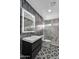 The bathroom is updated with stylish tile, a modern vanity, and a glass shower at 1940 E Citation Ln, Tempe, AZ 85284