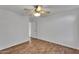 This bedroom features wood flooring and white walls at 1940 E Citation Ln, Tempe, AZ 85284