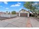 Traditional home featuring a two-car garage, a private courtyard, and a desert-style landscape at 1940 E Citation Ln, Tempe, AZ 85284