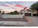 Charming home featuring a terra cotta roof, desert landscaping, and a private two-car garage at 1940 E Citation Ln, Tempe, AZ 85284