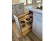 Kitchen cabinets featuring a pull-out with stainless steel cups at 1940 E Citation Ln, Tempe, AZ 85284