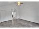 Open living room with modern flooring, large closet, and two doorways at 1940 E Citation Ln, Tempe, AZ 85284