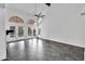 Spacious living area featuring a fireplace, stone floors, and vaulted ceilings offering lots of natural light at 1940 E Citation Ln, Tempe, AZ 85284