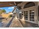Beautiful covered patio with tile flooring and french door access to the house at 1940 E Citation Ln, Tempe, AZ 85284