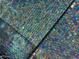Close up of pool iridescent tiles with a shimmering, colorful, mosaic-like pattern at 1940 E Citation Ln, Tempe, AZ 85284