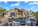 Backyard pool with decorative firepots, covered patio and tile decking at 1940 E Citation Ln, Tempe, AZ 85284